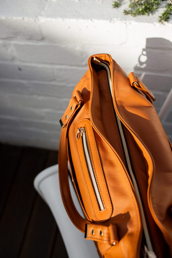 The Ultimate Tote bag from Swagger leather sitting on a chair